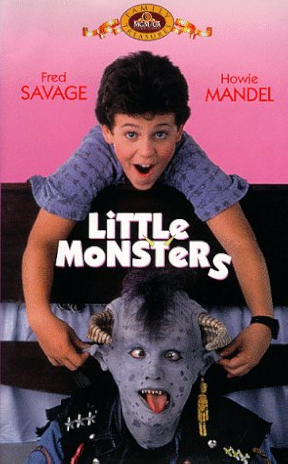 Movie poster for 'Little Monsters' featuring a boy with dark hair excitedly leaning over a bed while a blue-skinned monster with horns and a punk outfit looks up from the bed.